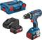 Cordless drill set comprising drill, charger, battery and carrying case. 'Bosch' brand name visible on the devices.