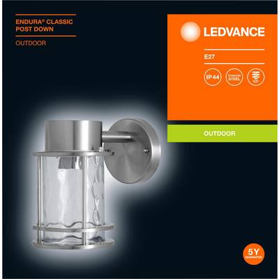 Silver exterior wall light with cylindrical glass. Brand name and technical specifications on the right: IP44, stainless steel, LED, E27, 5-year guarantee.