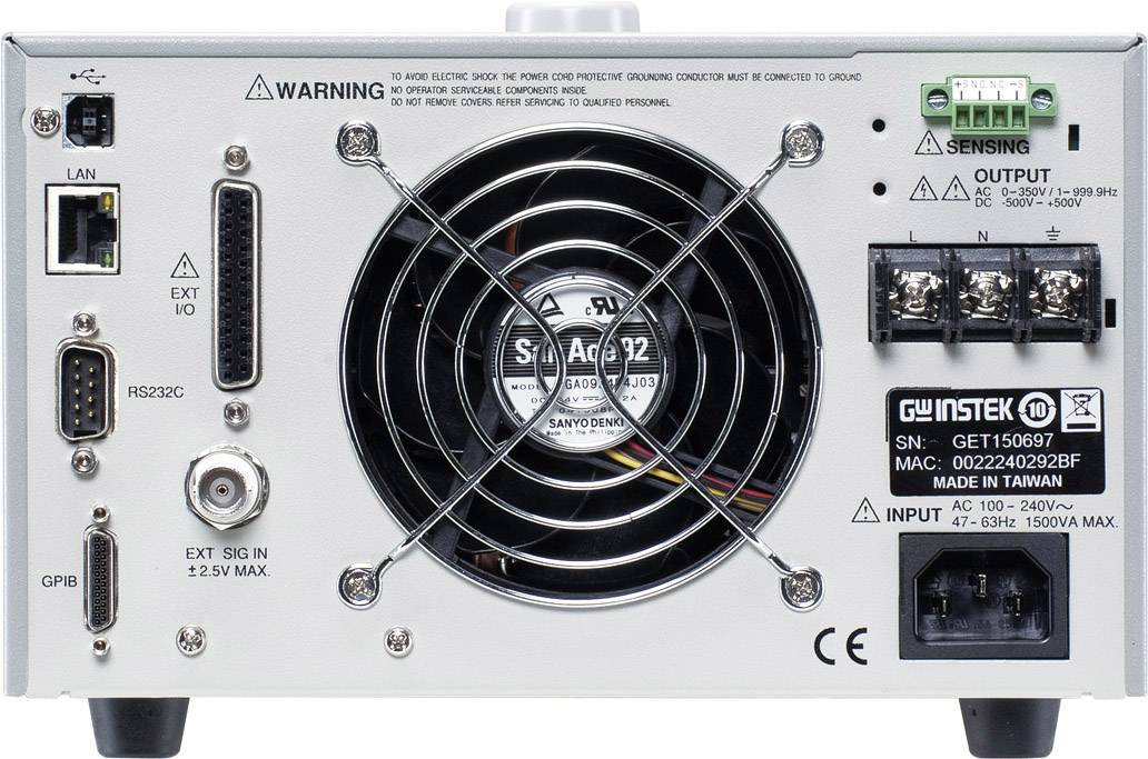 Back of an electronic device with a fan, various connection sockets, and safety instructions.