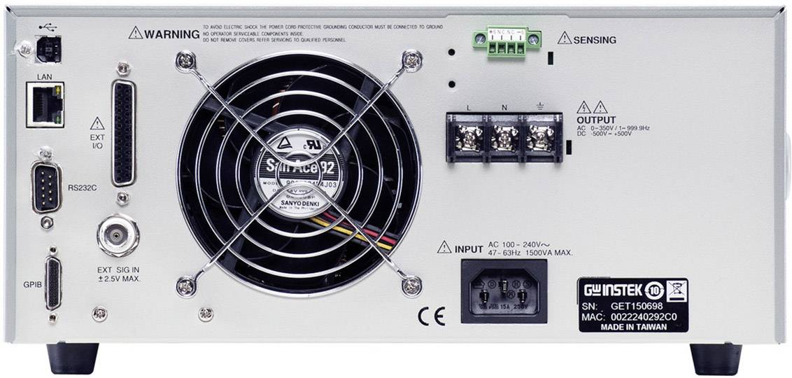 Back of an electronic device with a fan, ports, and warning labels. Includes input and output options along with voltage specifications.