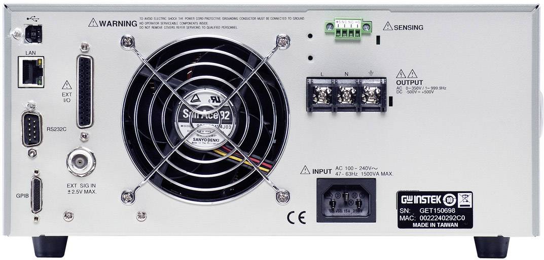 Back of a power supply unit with a fan and connection options, including LAN, RS232C, and various input and output ports.