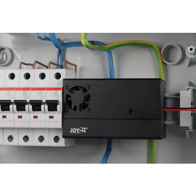 Fuse box with multiple switches and fan module. Colourful cables connect the components.