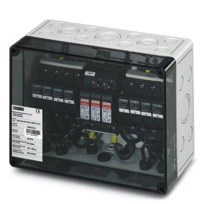 An electrical distribution enclosure with multiple switches and cable connections. A label with technical specifications is visible.