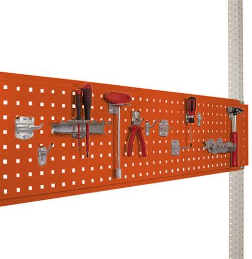 An orange pegboard with various tools, including a hammer, pliers, and screwdrivers, neatly arranged and hung.