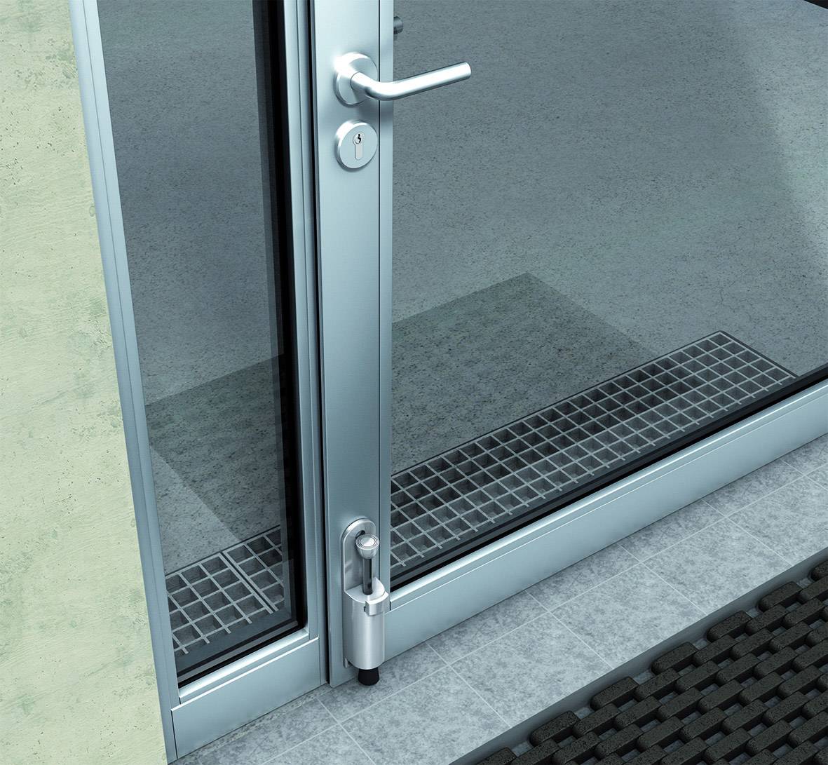 Glass door with a silver frame and handle, next to a green wall; underneath, a grey doormat and a grey tiled surface.