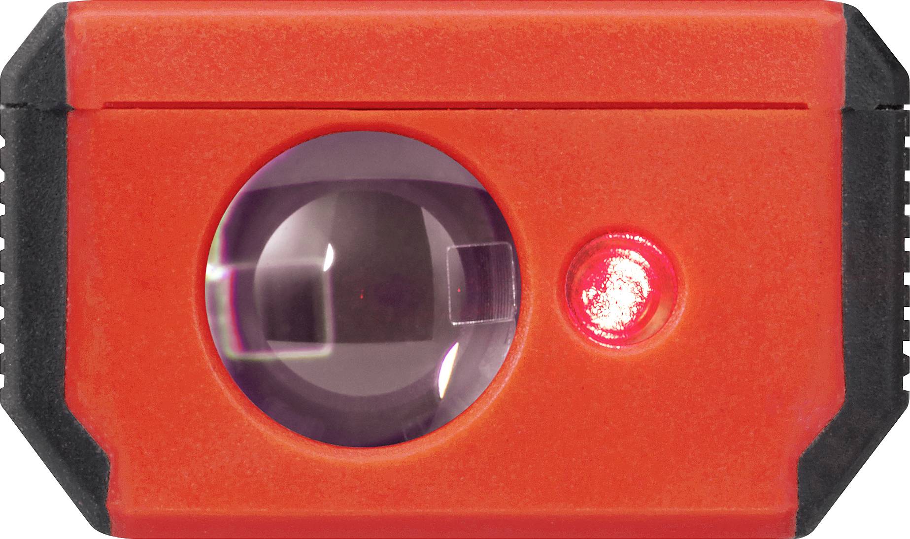 A red, rectangular object with a large lens in the centre and a smaller, illuminated light to the right of it.