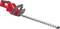 A red electric hedge trimmer with a long silver cutting blade, suitable for trimming hedges and shrubs.