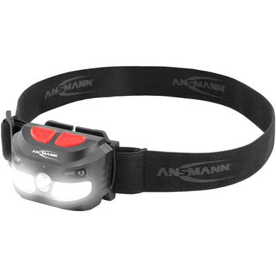 A black head torch with two red buttons and a luminous LED at the front, worn with an elastic headband.