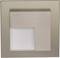 Square, silver wall light with modern design, partially concealed light emission on the bottom left. Square base shape.