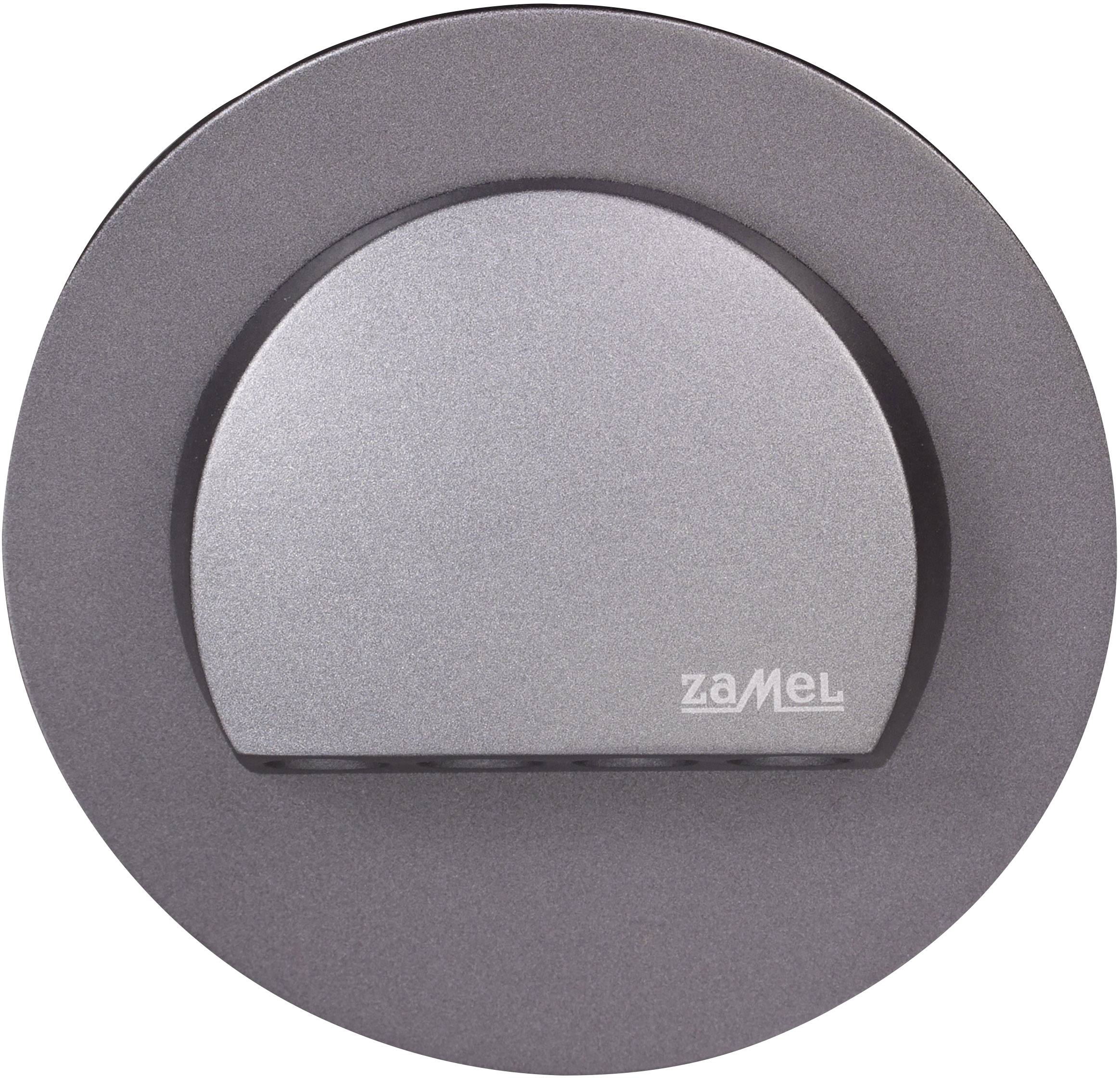 Round metallic light element with grey, semi-circular cover; brand name 'Zamel' in the bottom right.