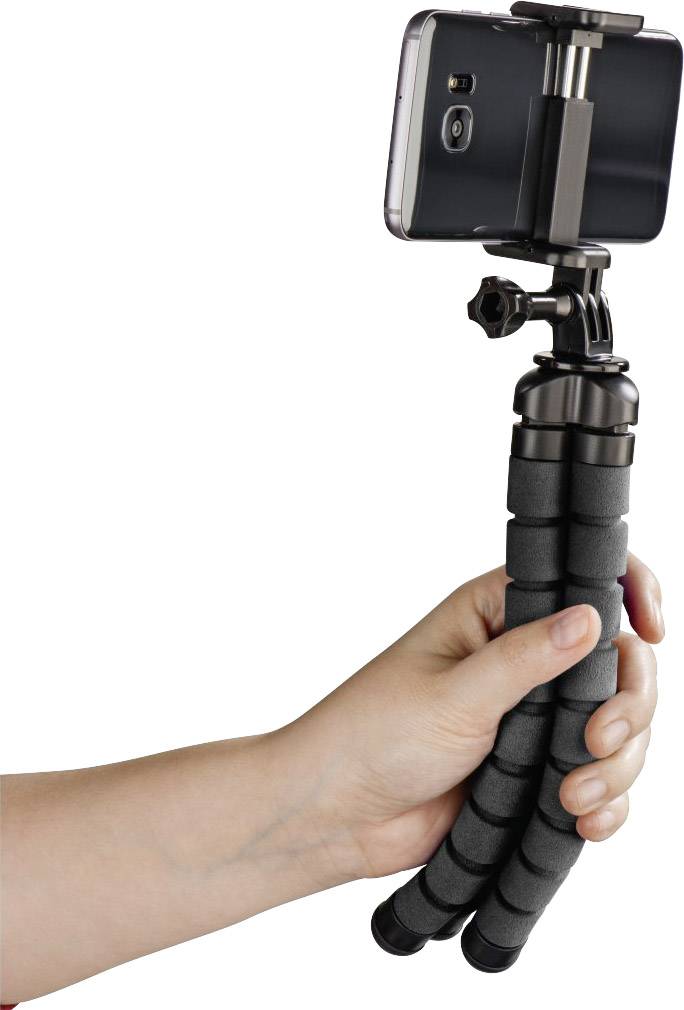 A smartphone is mounted on a flexible tripod being held by a hand.