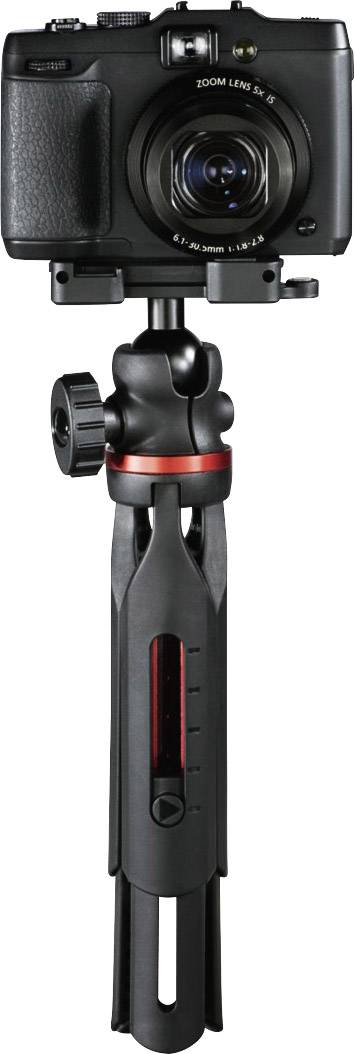 Digital camera mounted on a compact tripod, ready for photo or video recording.