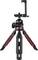 A compact, black tripod with three legs and red accents, featuring an adjustable mount for smartphones or cameras.