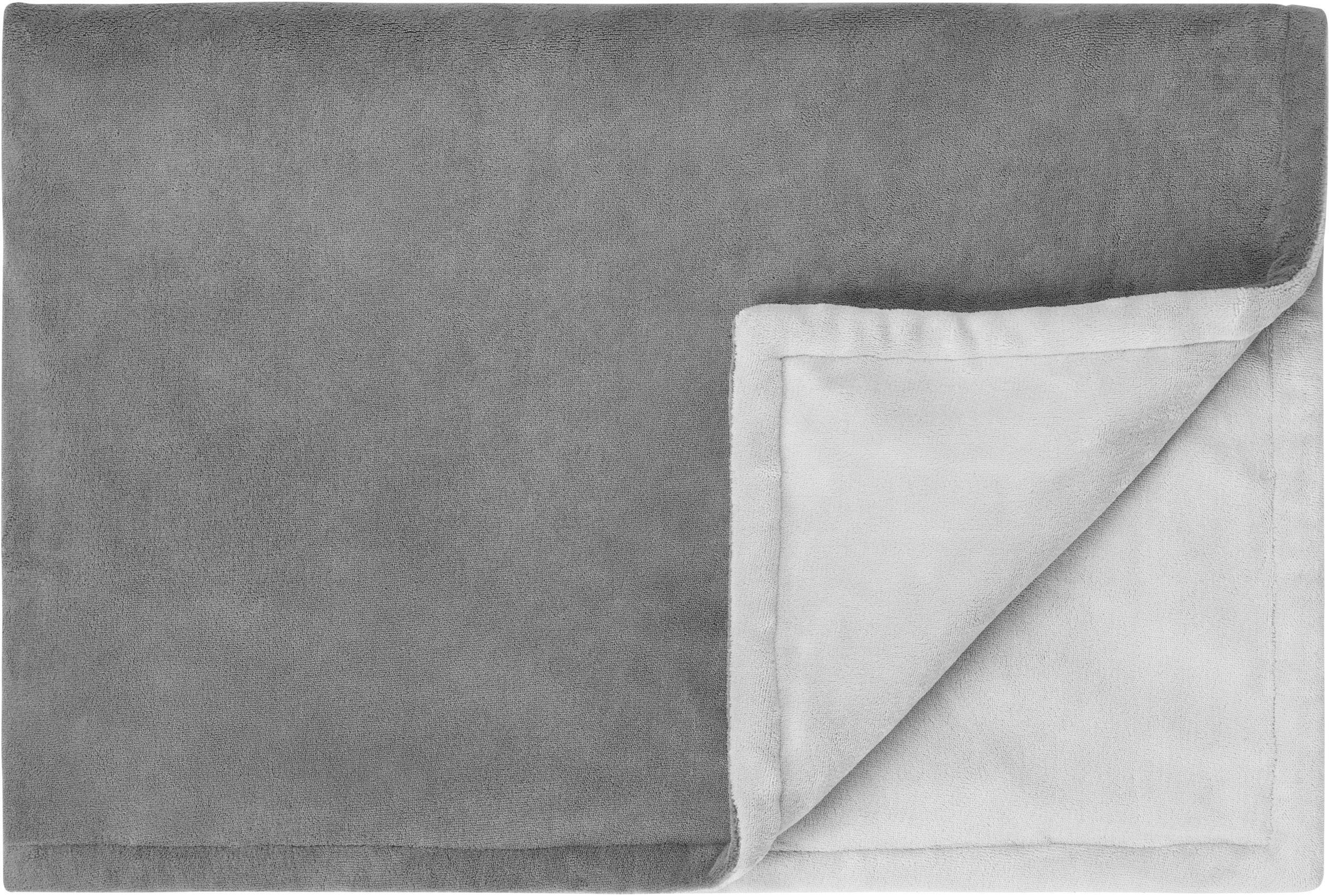 Grey blanket with soft texture, partially folded, revealing light inner lining. Ideal for living room or bedroom decor.