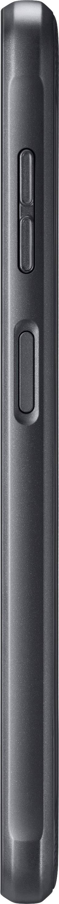 A black, slim electronic device in side profile, possibly a speaker or a similar technical device.