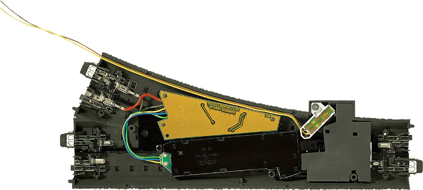 An electrical railway signal module in a black plastic casing with visible wiring and circuits mounted on a board.