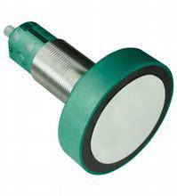 An inductive sensor with a green housing and a flat, circular head. Used for detecting objects without direct contact.