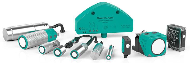 Various ultrasonic sensors in different sizes and shapes, displayed side by side on a white surface.