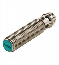 Metallic cylinder with a ribbed surface and a green end cap, potentially part of a technical device or mechanism.