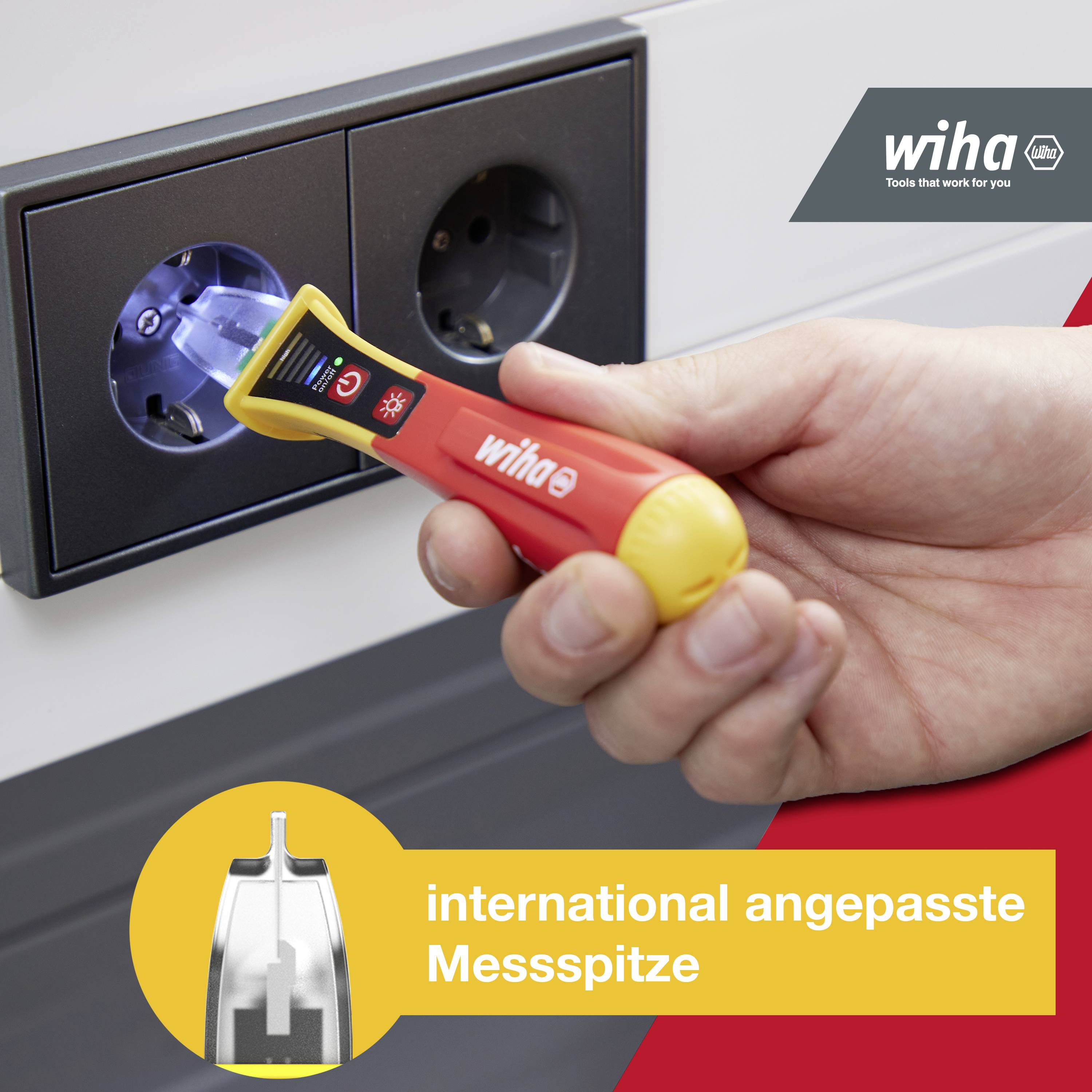 A person is testing a power socket with a voltage tester that is illuminated. Text in the image: 'internationally adapted measuring tip'.