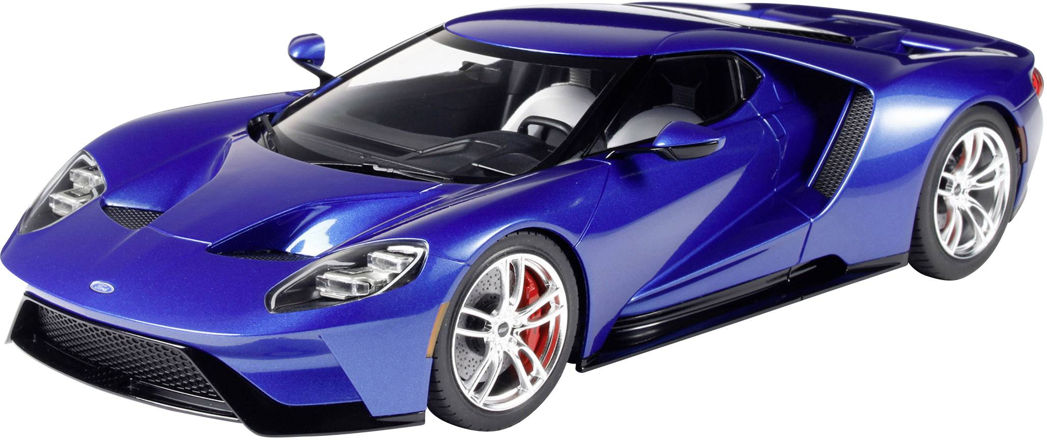 Blue sports car with a curved design, visible side air intake, silver wheels, and red brake calipers.