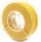 Yellow 3D printer filament spool in a transparent plastic packaging, showing material for 3D printing applications.
