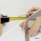 'A hand measures a distance with a tape measure and pencil, while another hand uses a ruler for precision. Metylan logo in corner.'