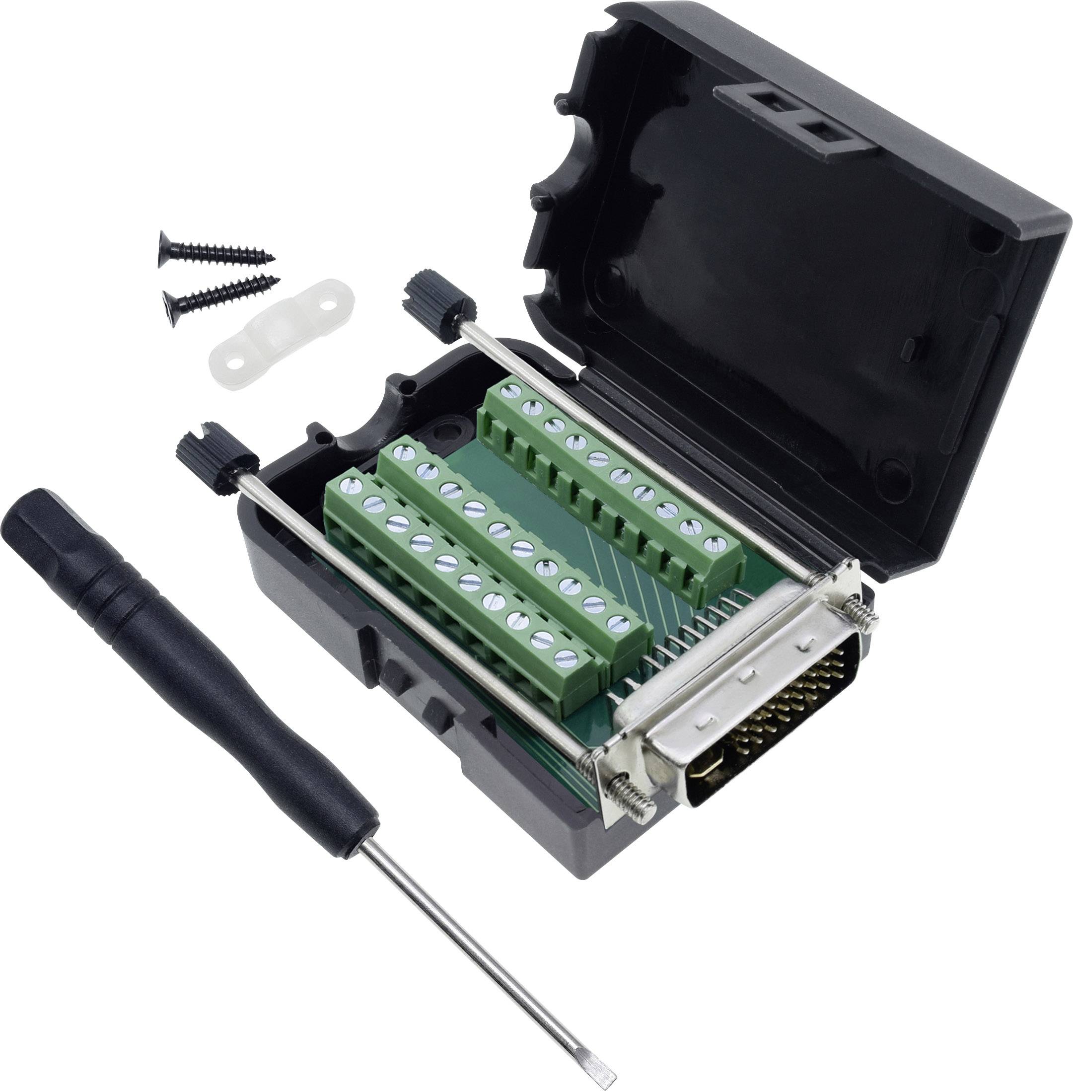 An open black casing with green internal components for electronic connections, a small screwdriver, and loose screws.
