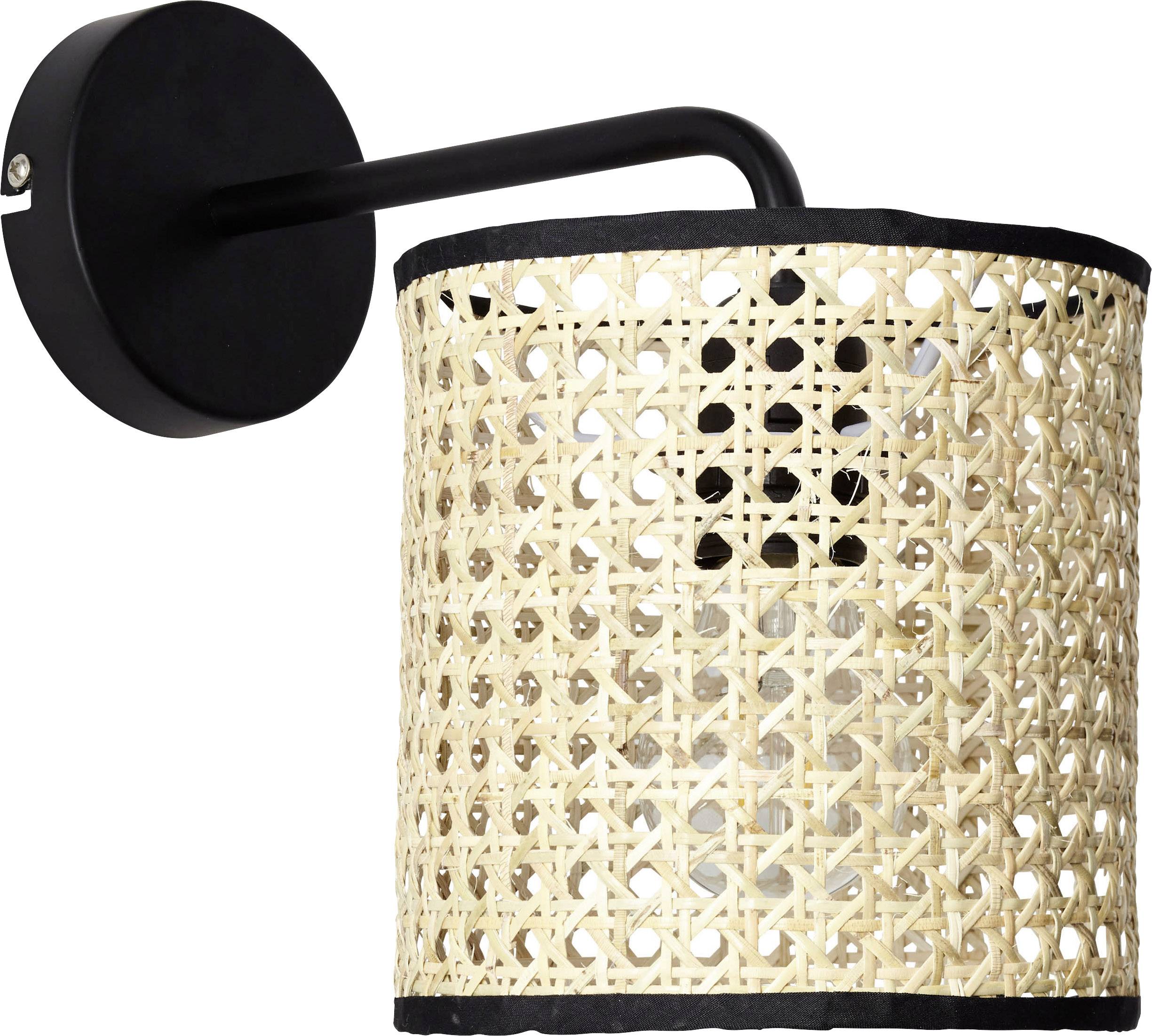 Wall light with a black wall bracket and a cylindrical lampshade made of woven bamboo mesh, which emits a soft light.