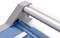 Close-up of a paper trimmer with a blue cutting surface, two metal bars, and a grey casing.