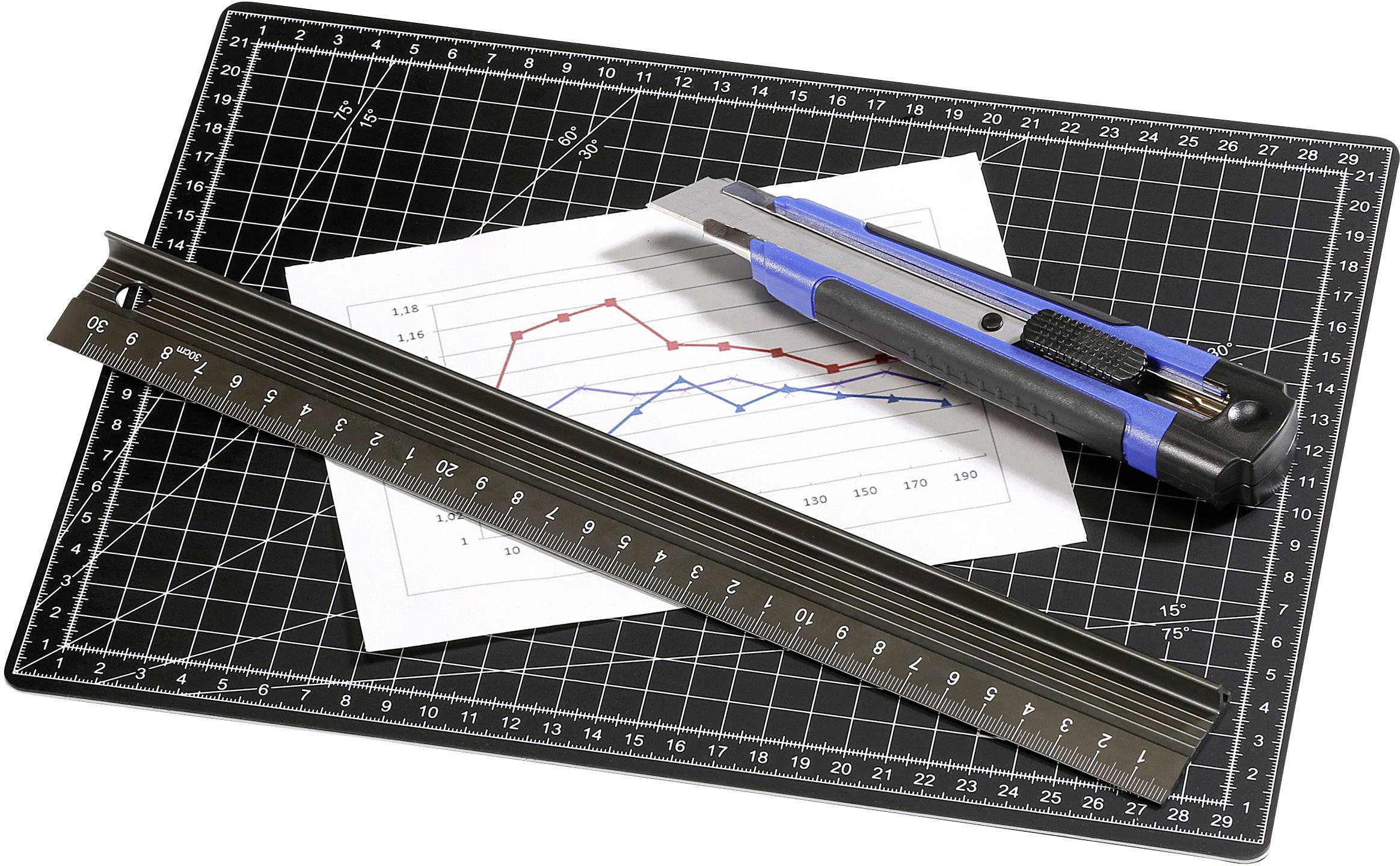 Ruler, craft knife and diagram on a black cutting mat. Diagram shows fluctuating red and blue lines.