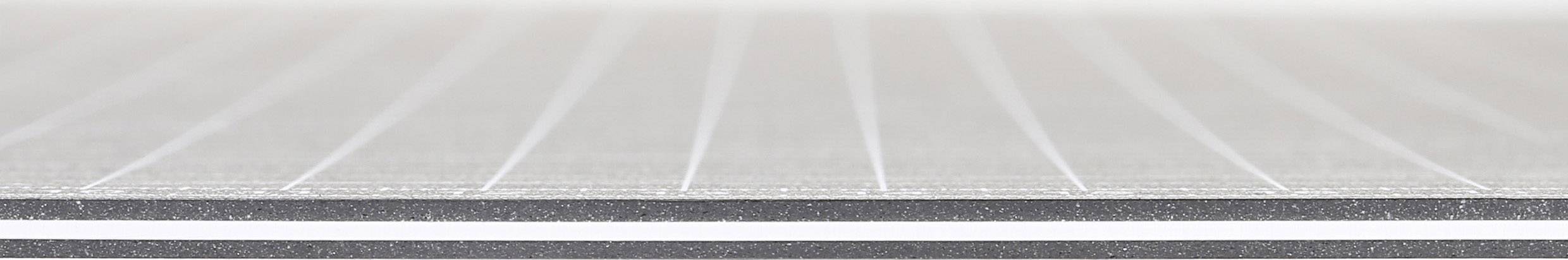 Silver metal plates with parallel lines, creating a structured, modern impression.