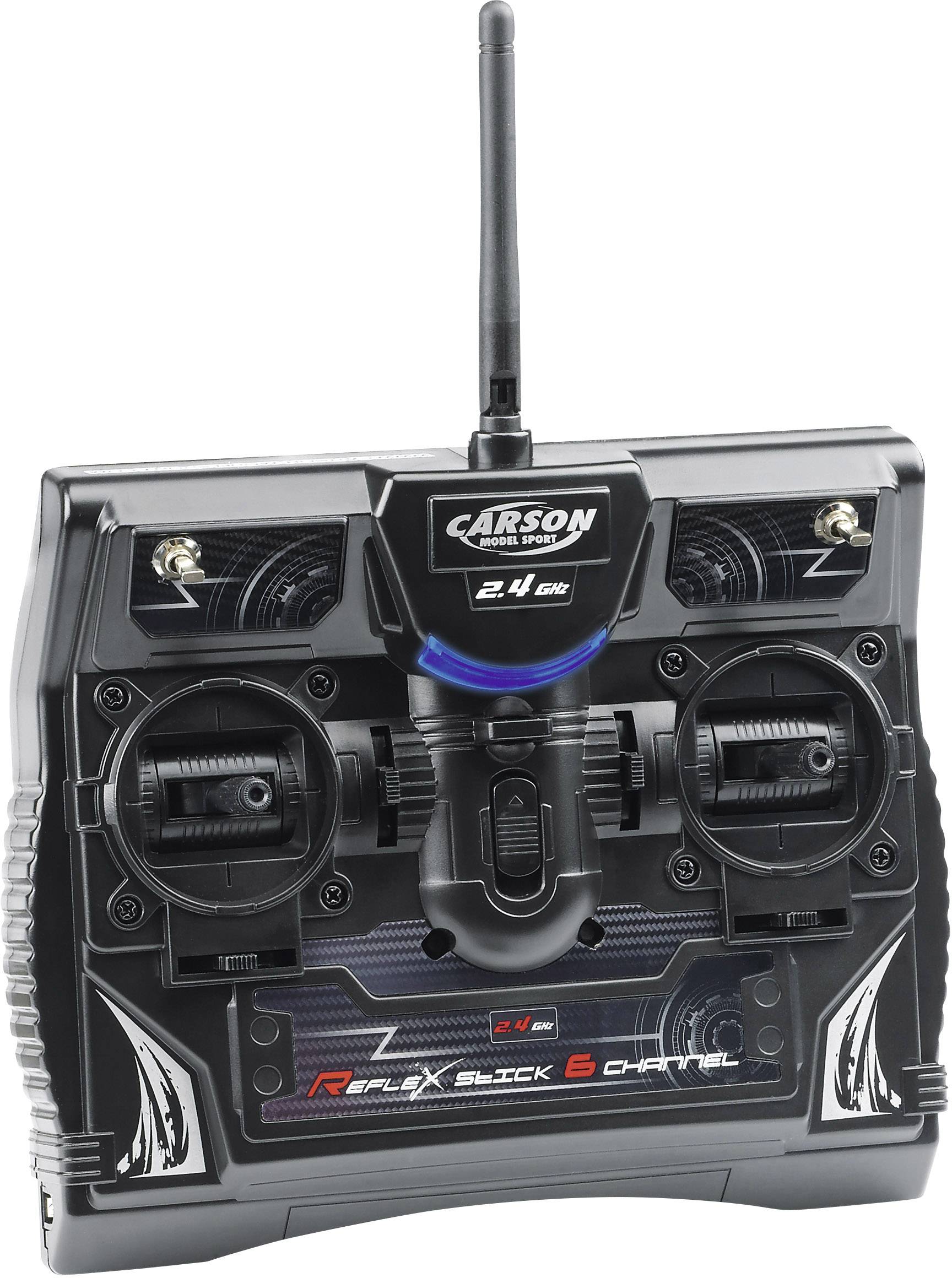 A black remote control for RC models with two joysticks and an antenna. Marked with 'Reflex Stick 6 Channel'.