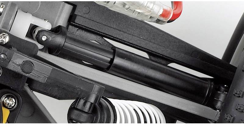 Close-up of a shock absorber in a mechanical system, with visible springs and joints. Focusing on technical details.