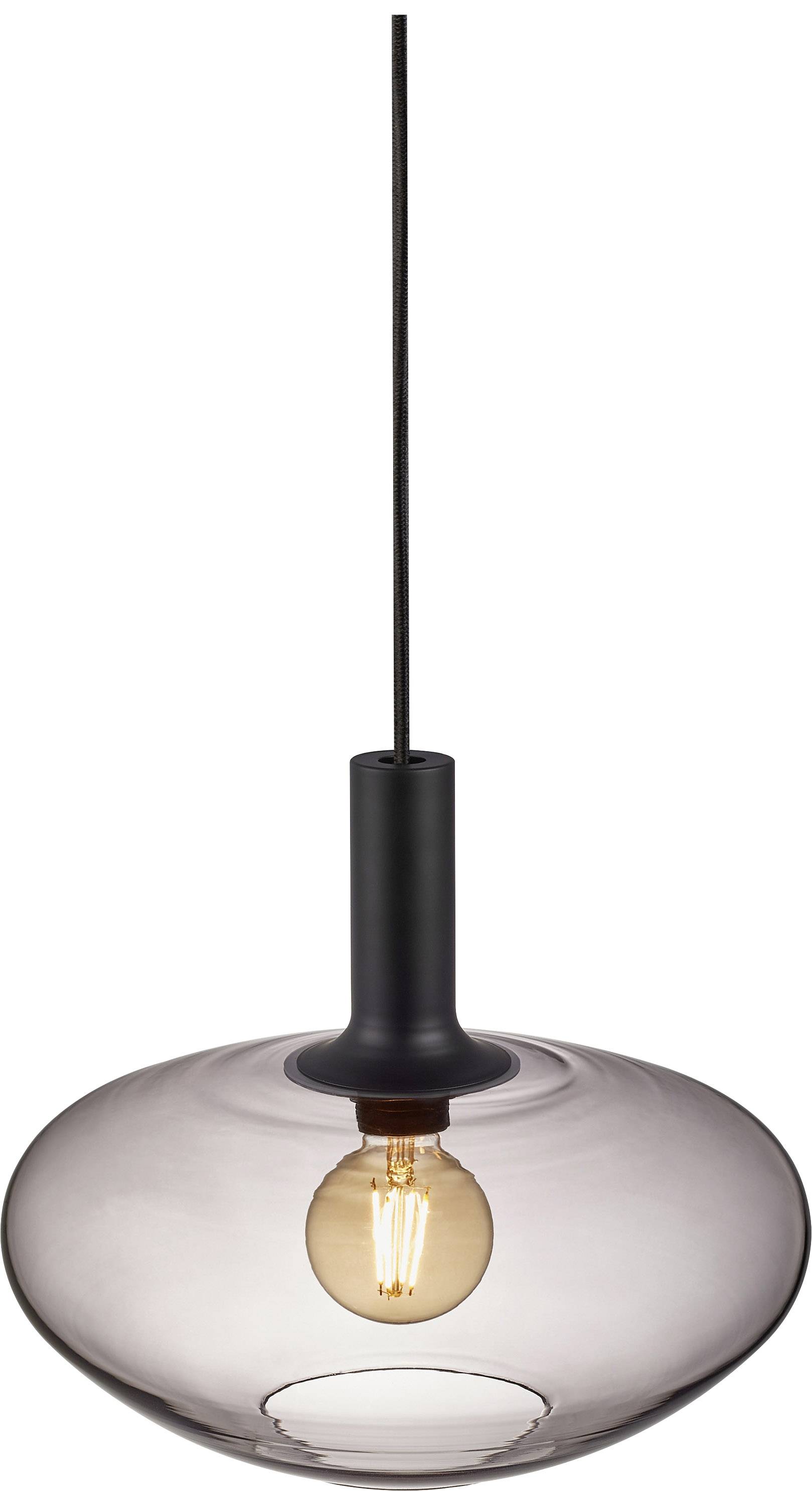 A contemporary pendant light with transparent glass and a visible bulb hangs from a black cable, glowing in warm light.