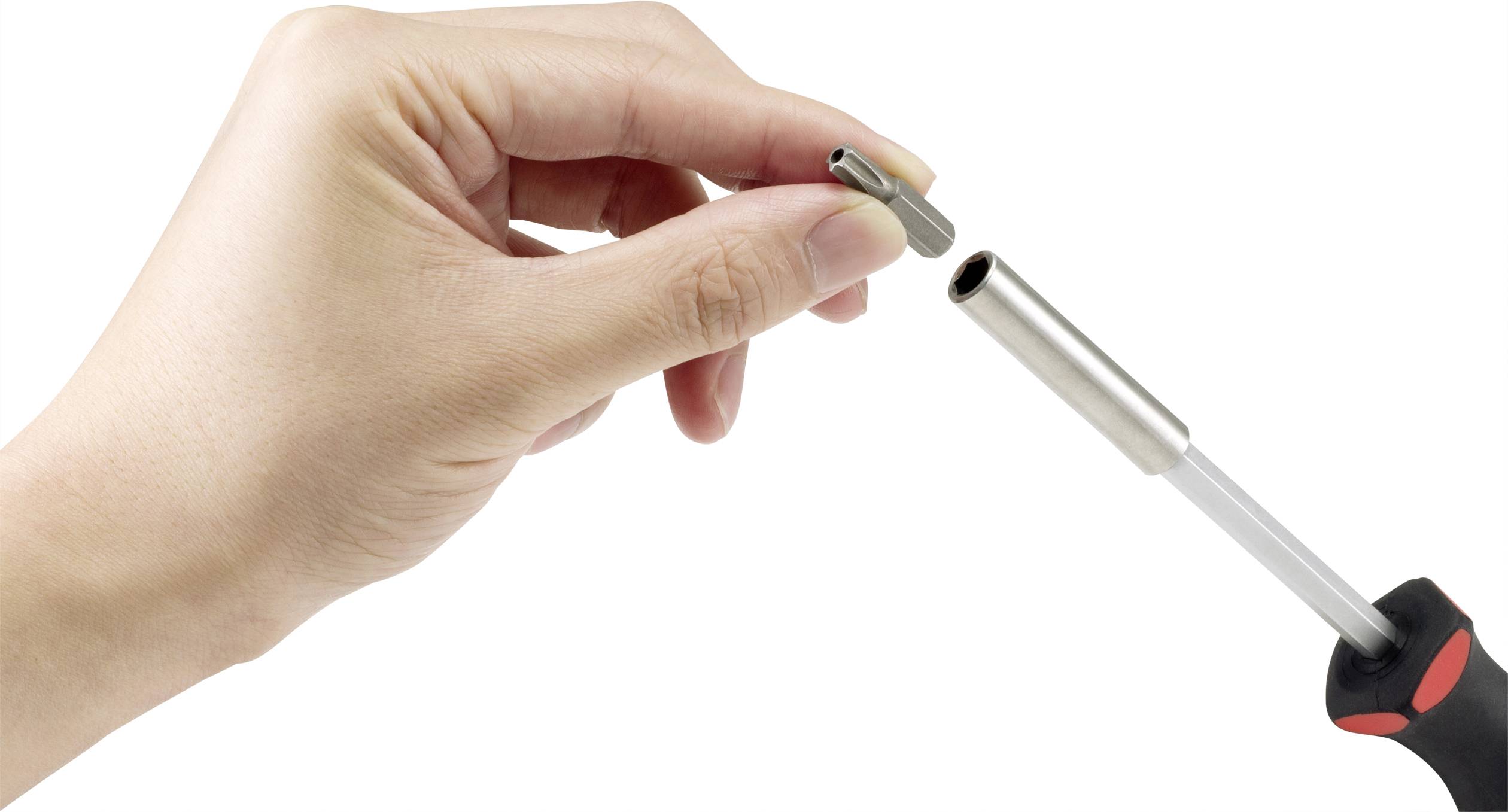 A hand is placing a nozzle onto a gas burner.