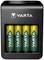 A charger with four rechargeable AA batteries by Varta. The device is black and compact, suitable for household use.