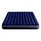 A dark blue inflated air mattress with a ribbed structure, lying on a flat surface.