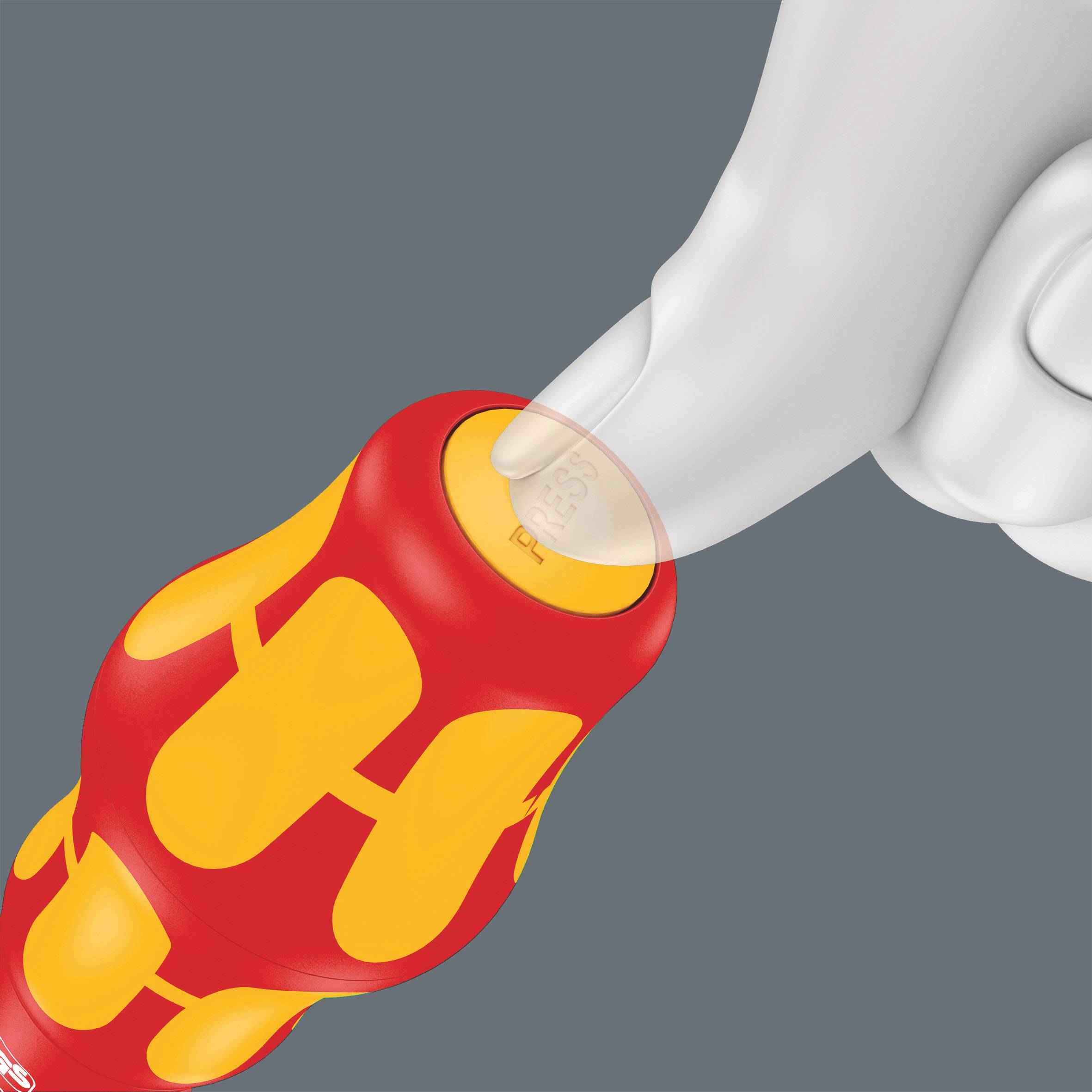 A hand is pressing down on the tip of a red screwdriver with yellow accents. The screwdriver has an ergonomic handle.