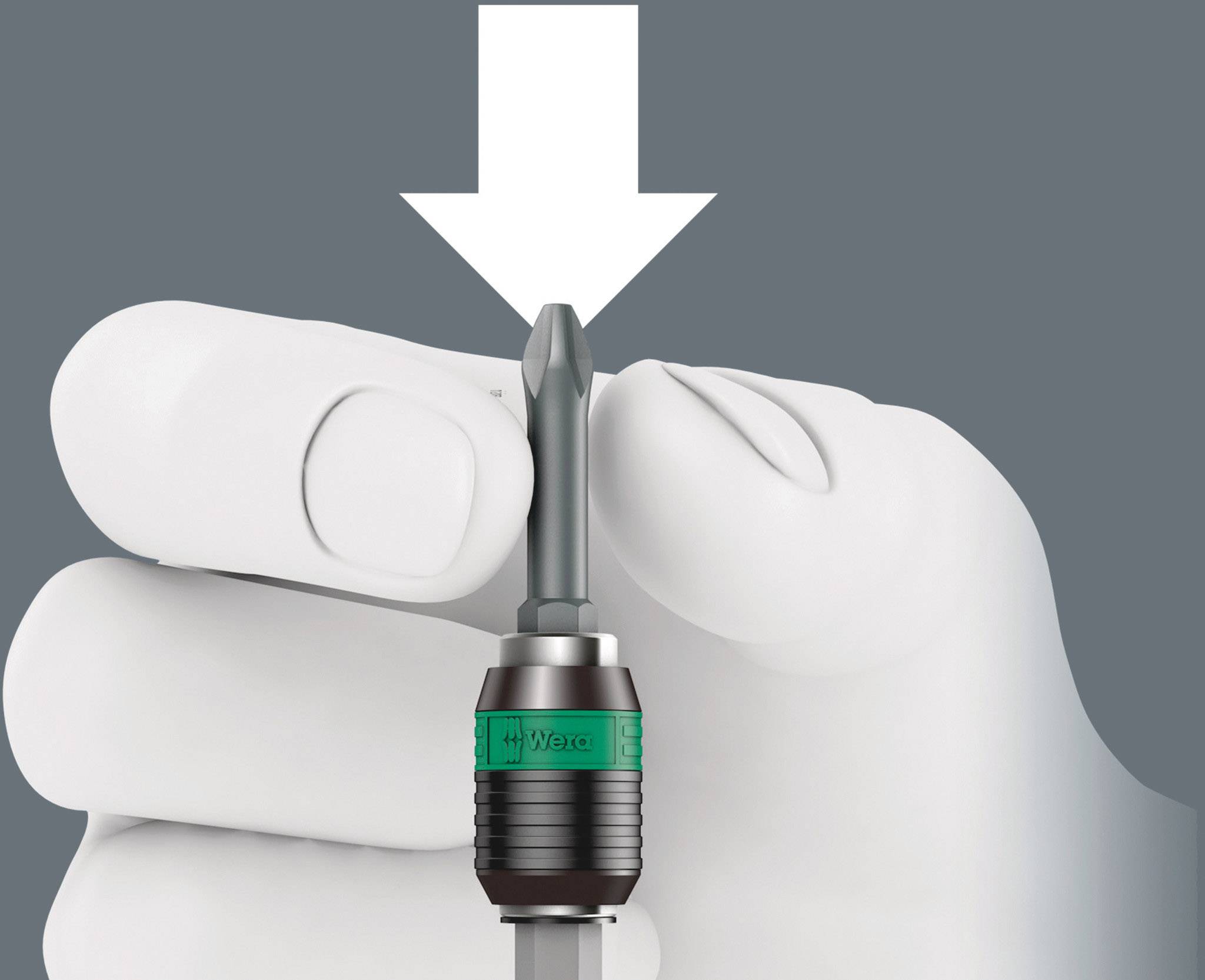 A hand is holding a screwdriver bit, with an arrow pointing downwards, presumably to indicate inserting the bit into a screwdriver.