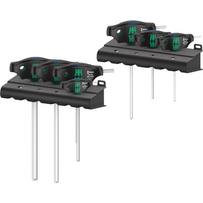 Six black T-keys with green details in two holders for screws and nuts.