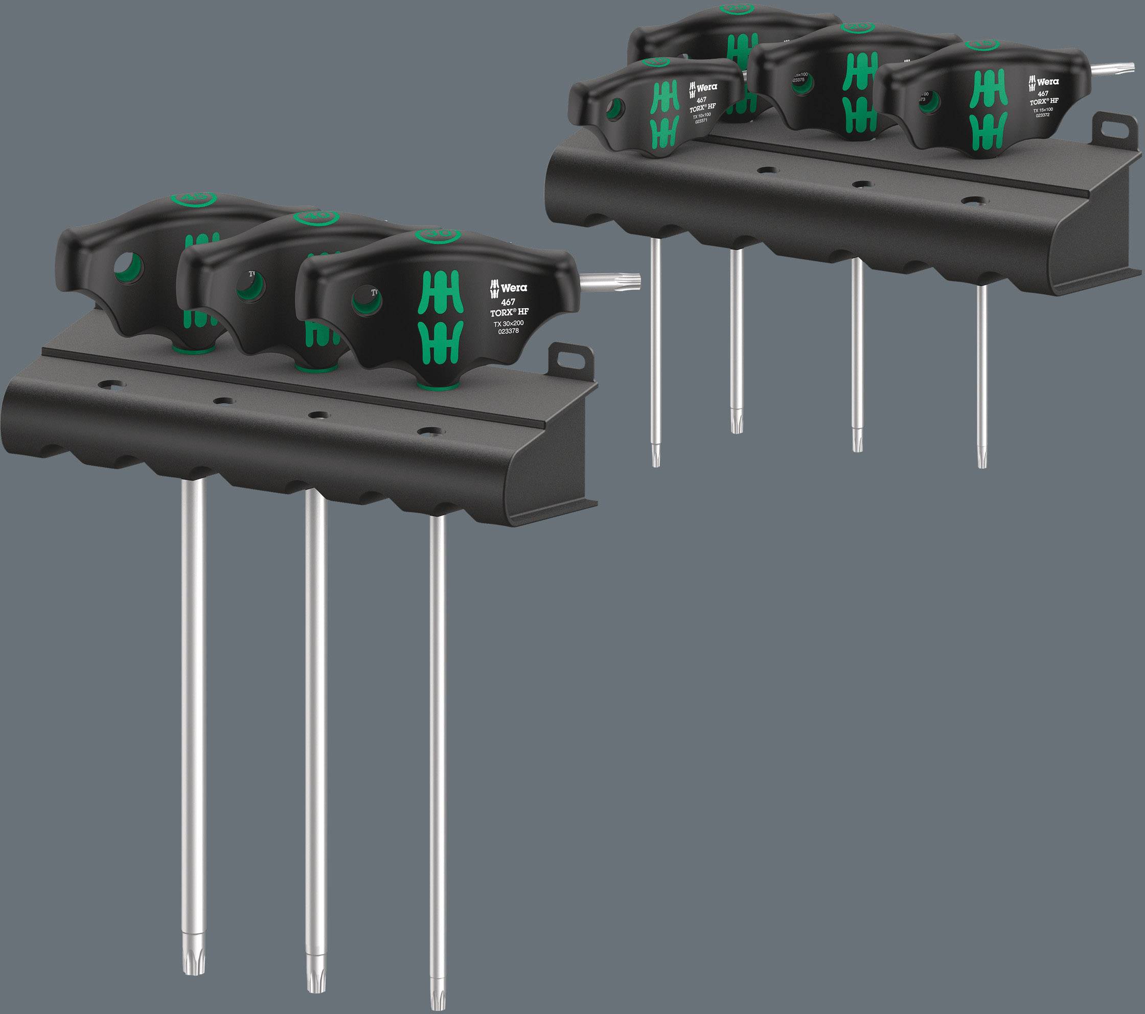 Two black tools with green accents, mounted on a metal bracket. Each tool has a long, slender rod.