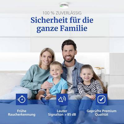 A family of four smiles in a living room. Text promotes safety features: early smoke detection, loud signal, certified quality.