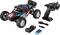 A remote-controlled car with large profile tyres, remote control, batteries, charger and screwdriver, on a white background.