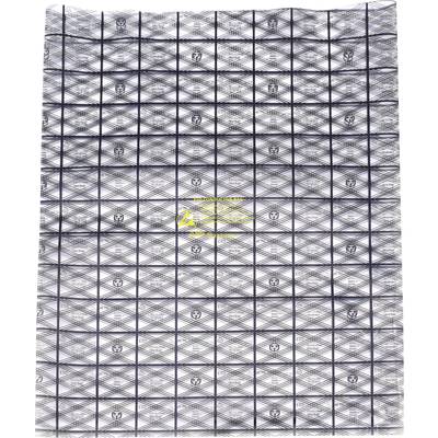 A paper pattern displays a complex, geometric design in black and white with a yellow logo in the centre.
