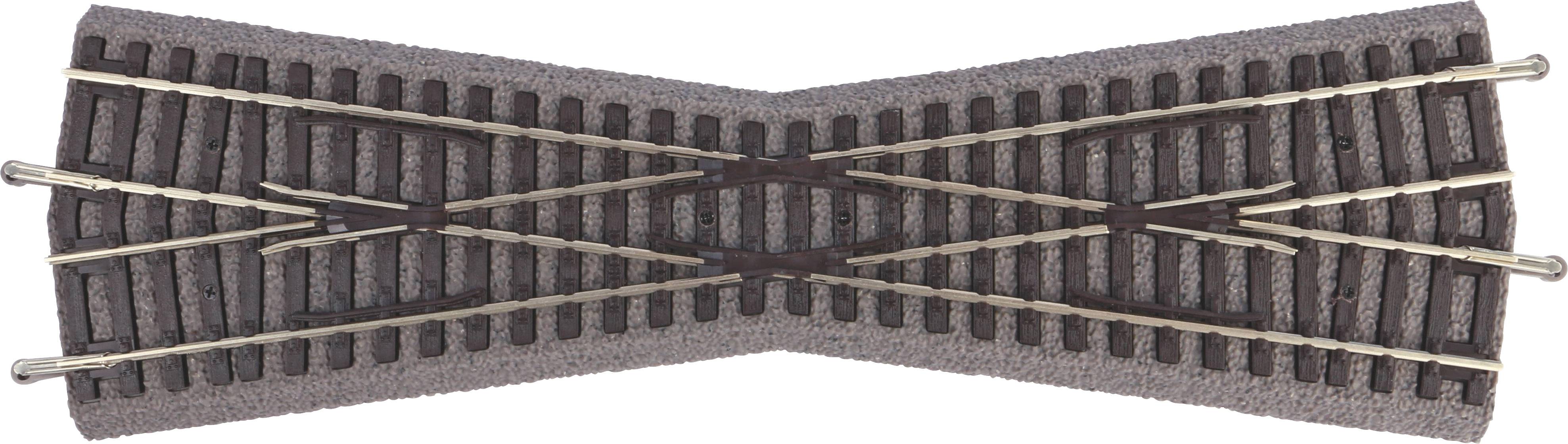 Crossing of a model railway track with a ballast bed. The rails intersect to change directions.