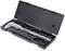A metal vernier calliper lies in an open black plastic case. The case shows compartments for storing the tool.