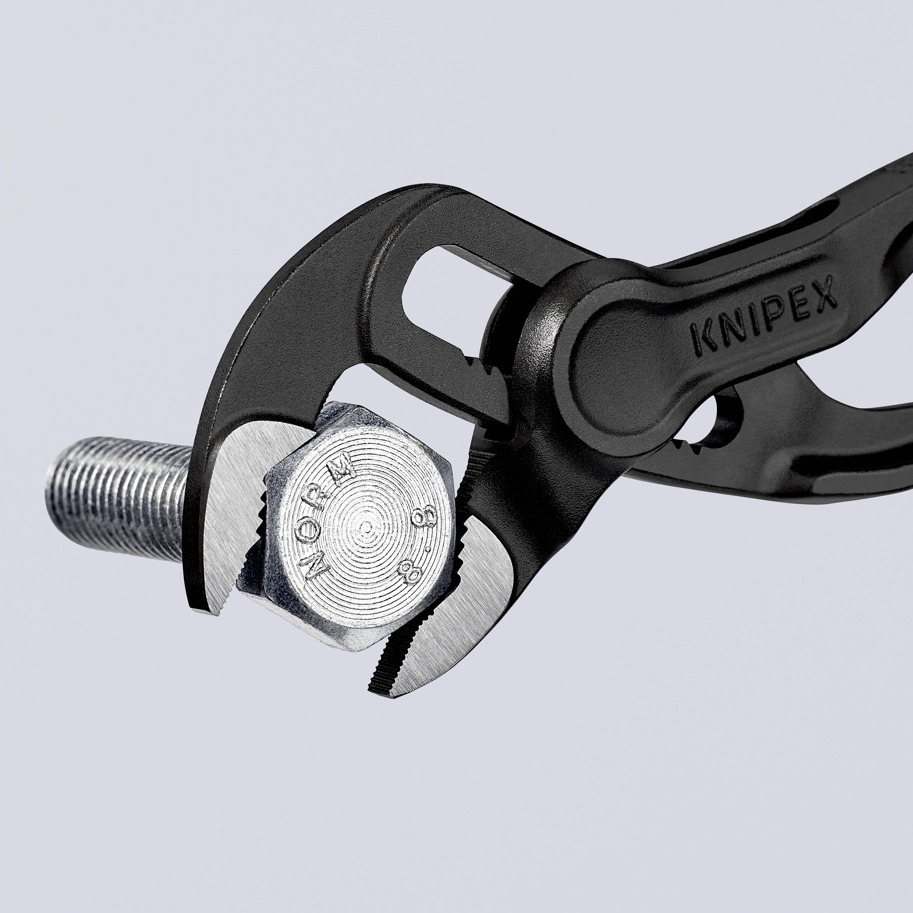 A KNIPEX pliers grips a hexagonal bolt firmly. The pliers' design enables a secure grip, ideal for tightening or loosening.