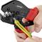 A hand is holding a red Knipex crimping pliers to secure a yellow cable lug to a cable strand with green and yellow insulation.