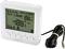 Digital thermostat with LCD display showing room temperature and settings. Cable sensor lies beside it. Brand name 'sygonix' visible.